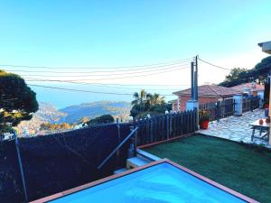 a house with a swimming pool in a yard at Romantic Nest lloret in Lloret de Mar