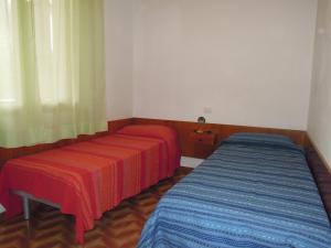 A bed or beds in a room at Wonderful Villa in a quiet place in Bibione