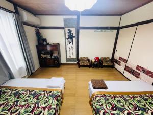 Postel nebo postele na pokoji v ubytování Shiga Biwa Lake Shanshui House