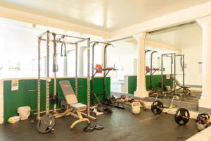 a gym with a bunch of equipment on the floor at Central Bright 3 Bed Flat with Pool & Parking in Edinburgh