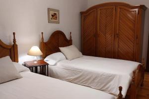 A bed or beds in a room at La Casona de Teo