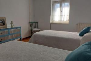 A bed or beds in a room at La Casona de Teo