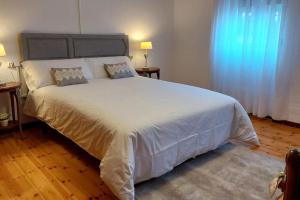 A bed or beds in a room at La Casona de Teo