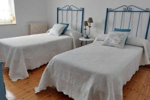A bed or beds in a room at La Casona de Teo