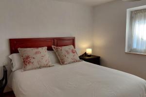 A bed or beds in a room at La Casona de Teo