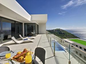 a balcony of a house with a view of the ocean at Francelho 2 Aparment by MHM in Ribeira Brava