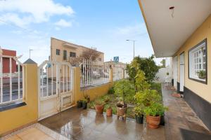 a balcony of a house with potted plants at Estudio Mario in Las Lagunas