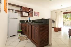 A kitchen or kitchenette at Flat Térreo Visual Jardim 2 dormitorios Brisas do Amor