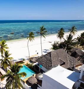 a view of the beach from the balcony of a resort at Alladin Boutique Beach Hotel and SPA Zanzibar in Matemwe