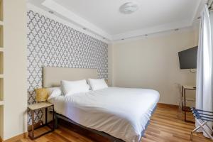 Postel nebo postele na pokoji v ubytování H-A Hotel Trebol
