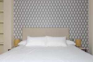 Postel nebo postele na pokoji v ubytování H-A Hotel Trebol + 37 fotografií
