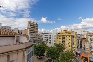 Nespecifikovaný výhled na destinaci Málaga nebo výhled na město při pohledu z hotelu