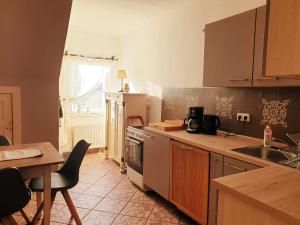 a kitchen with a sink and a stove top oven at Bensdorfer Mühle - Auszeit in Brandenburg in Bensdorf