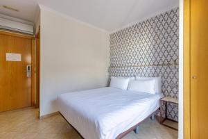 Postel nebo postele na pokoji v ubytování H-A Hotel Trebol