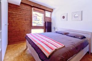 Voodi või voodid majutusasutuse Joli appartement ensoleillé à Vercorin toas