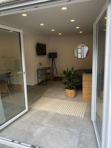 a room with a sliding glass door and a living room at Ferienwohnung Schleifnest in Heppenheim an der Bergstrasse