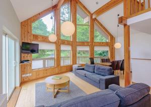 a living room with a couch and a table at Penvale Lakes Lodges in Llangollen