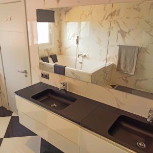 a bathroom with a sink and a mirror at La Casa De Nu Torremuelle 7 Bed Luxury Villa in Torremuelle