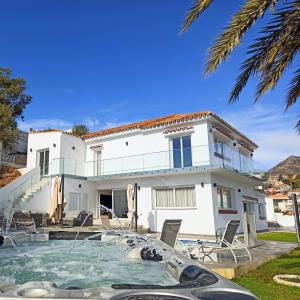 a villa with a swimming pool and a house at La Casa De Nu Torremuelle 7 Bed Luxury Villa in Torremuelle