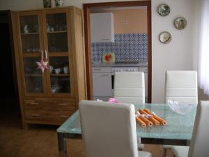 a kitchen and dining room with a table and chairs at Ferienwohnung Herrig in Treis-Karden