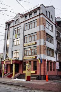 a building on the corner of a street at Fontush Boutique Hotel in Ivano-Frankivsk