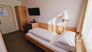 Postel nebo postele na pokoji v ubytování Hotel Garni Superior