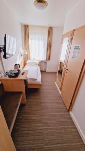 Postel nebo postele na pokoji v ubytování Hotel Garni Superior