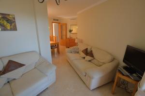 Televízia a/alebo spoločenská miestnosť v ubytovaní Sun Hill Los Pacos 2 Bed Apt