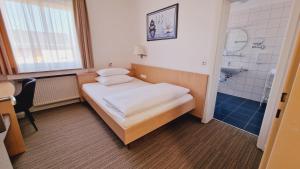 Postel nebo postele na pokoji v ubytování Hotel Garni Superior