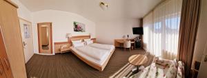 Postel nebo postele na pokoji v ubytování Hotel Garni Superior