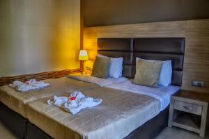 Postel nebo postele na pokoji v ubytování Rachoni Resort
