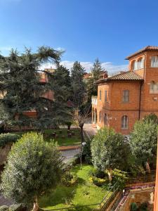 an aerial view of a building and a yard with trees at La Casa di Nazareth in Rome