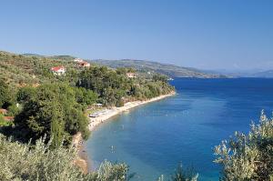 a view of a beach with people in the water at Katia Hotel in Afissos