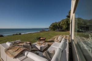 a balcony with a view of the ocean at Little Cottage in Praa Sands