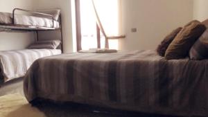 Postel nebo postele na pokoji v ubytování Maison Giulia