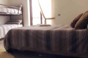 Postel nebo postele na pokoji v ubytování Maison Giulia + 4 fotografie