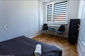 Posteľ alebo postele v izbe v ubytovaní Apartament u Kasi z widokiem na Zamek Malborski