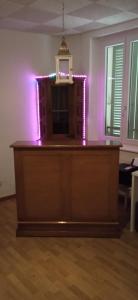 a courtroom with purple lights on top of a desk at VIP Appartment Centre Payerne in Payerne