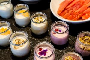 a group of candles in glass jars on a table at Catalonia Port in Barcelona