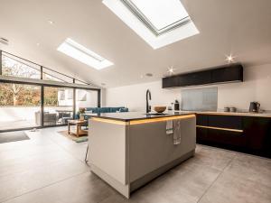 a kitchen with skylights and a counter in a room at Pass the Keys Luxury holiday home in Exmouth with parking in Exmouth