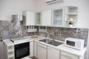 Kuchyňa alebo kuchynka v ubytovaní Sofia Apartment