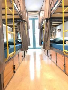 a room with four bunk beds in a building at THE JOYS HOSTEL in Ho Chi Minh City