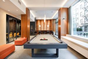 a billiard room with a pool table at 1BR in Hip E Village w Doorman Gym NYC-150 in New York