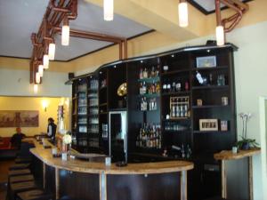a bar in a restaurant with a lot of alcohol at Raffelberger Hof in Mülheim an der Ruhr