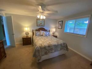 a bedroom with a bed and a ceiling fan at Salt water pool house near beach for monthly rental in Venice +21 photos