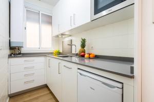 A kitchen or kitchenette at Apartamentos Cruz de San Andrés