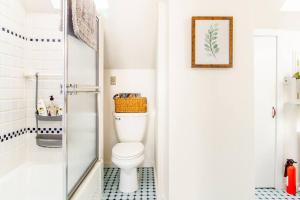 a bathroom with a white toilet and a shower at Urban Oasis in Hope Village in Providence +25 photos