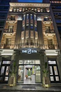 a building with the zir sign on the front of it at Athens The L7 Str - Luxury Boutique Collection Hotel in Athens