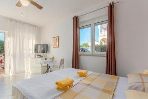 Ένα ή περισσότερα κρεβάτια σε δωμάτιο στο Apartment Zora