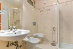 a bathroom with a sink and a toilet and a shower at Cencherle in Novigrad Istria +22 photos